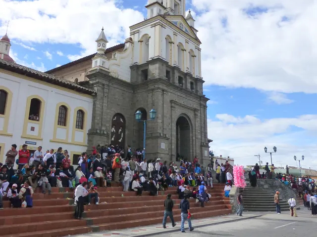 Crowd watches from the steps of the Church. Per wikitravel.org website, "Cotacachi Village is a small town of 20.000 inhabitants some 20km north of Otavalo. The town is famous for its leather goods."