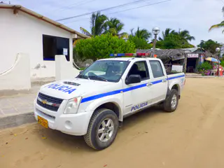 Police car in Puerto Villamil.