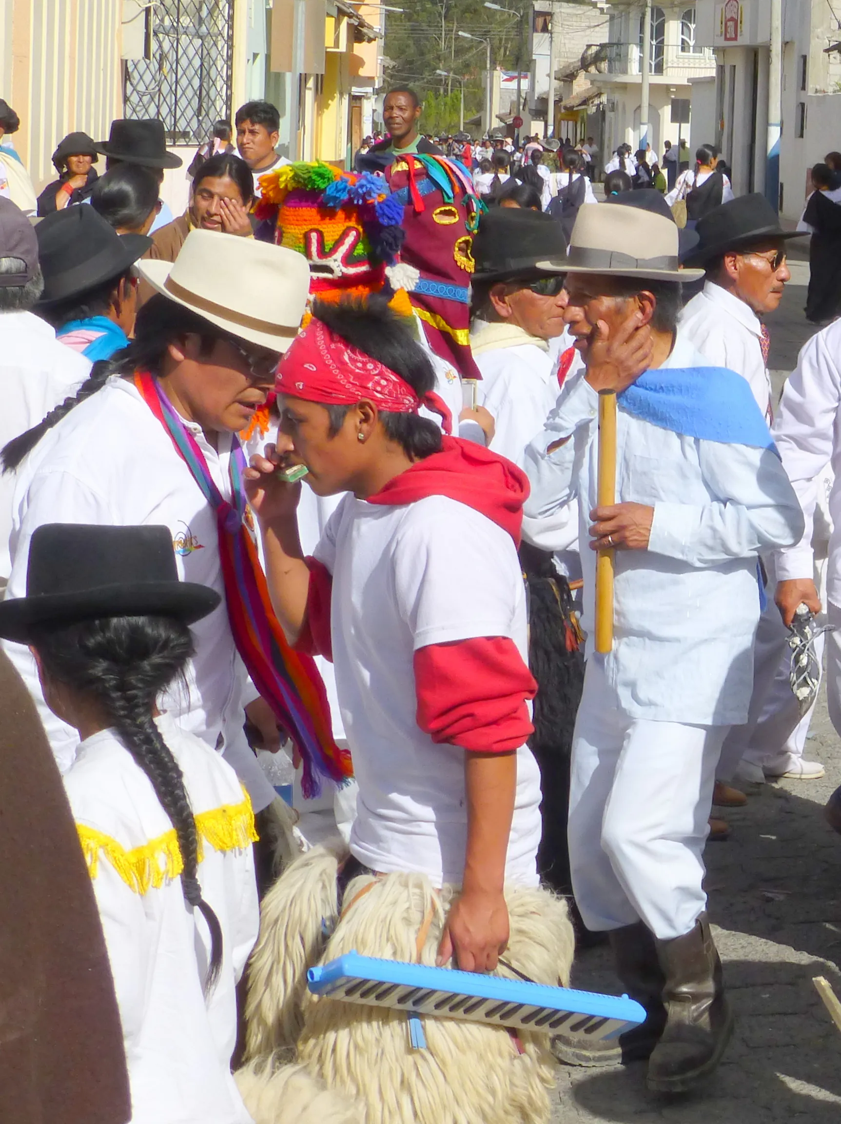 The procession walked in circles for a time.  Per wikitravel.org website, "Cotacachi Village is a small town of 20.000 inhabitants some 20km north of Otavalo. The town is famous for its leather goods."