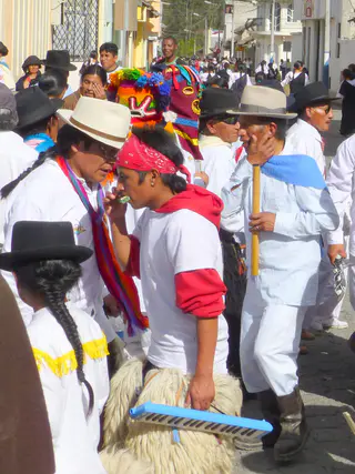 The procession walked in circles for a time.  Per wikitravel.org website, "Cotacachi Village is a small town of 20.000 inhabitants some 20km north of Otavalo. The town is famous for its leather goods."