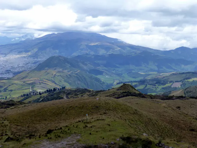 View of a volcano and farm land west of Quito.   The top of the El Teleferico is 4,050 meters high, far above timberline.