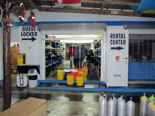 Guest locker at the end of the day, with the gear in storage and the boat's water coolers awaiting refilling for the next day's diving.