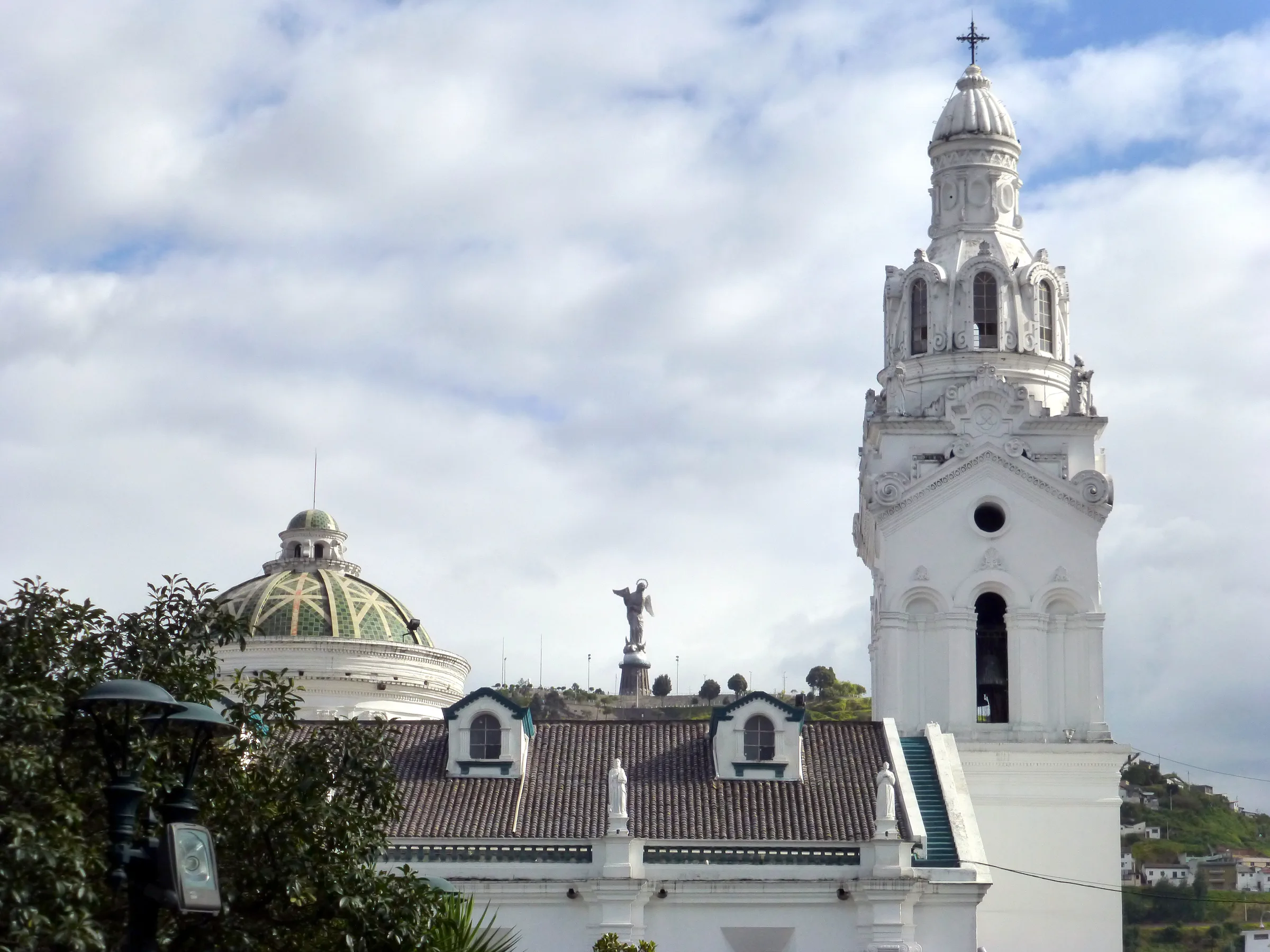 Church on Plaza de la Independencia (Plaza Grande), beside the Presidential Palace. Winged madonna statue is in the distance on the hilltop.