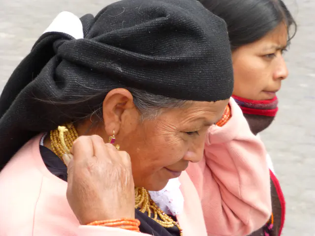 Otavalo woman with gold necklaces and earrings.