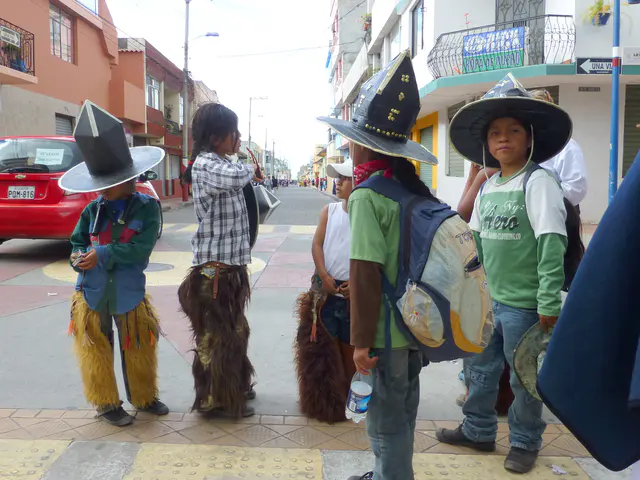 Boys awaiting their participation in the festival. Per wikitravel.org website, "Cotacachi Village is a small town of 20.000 inhabitants some 20km north of Otavalo. The town is famous for its leather goods."
