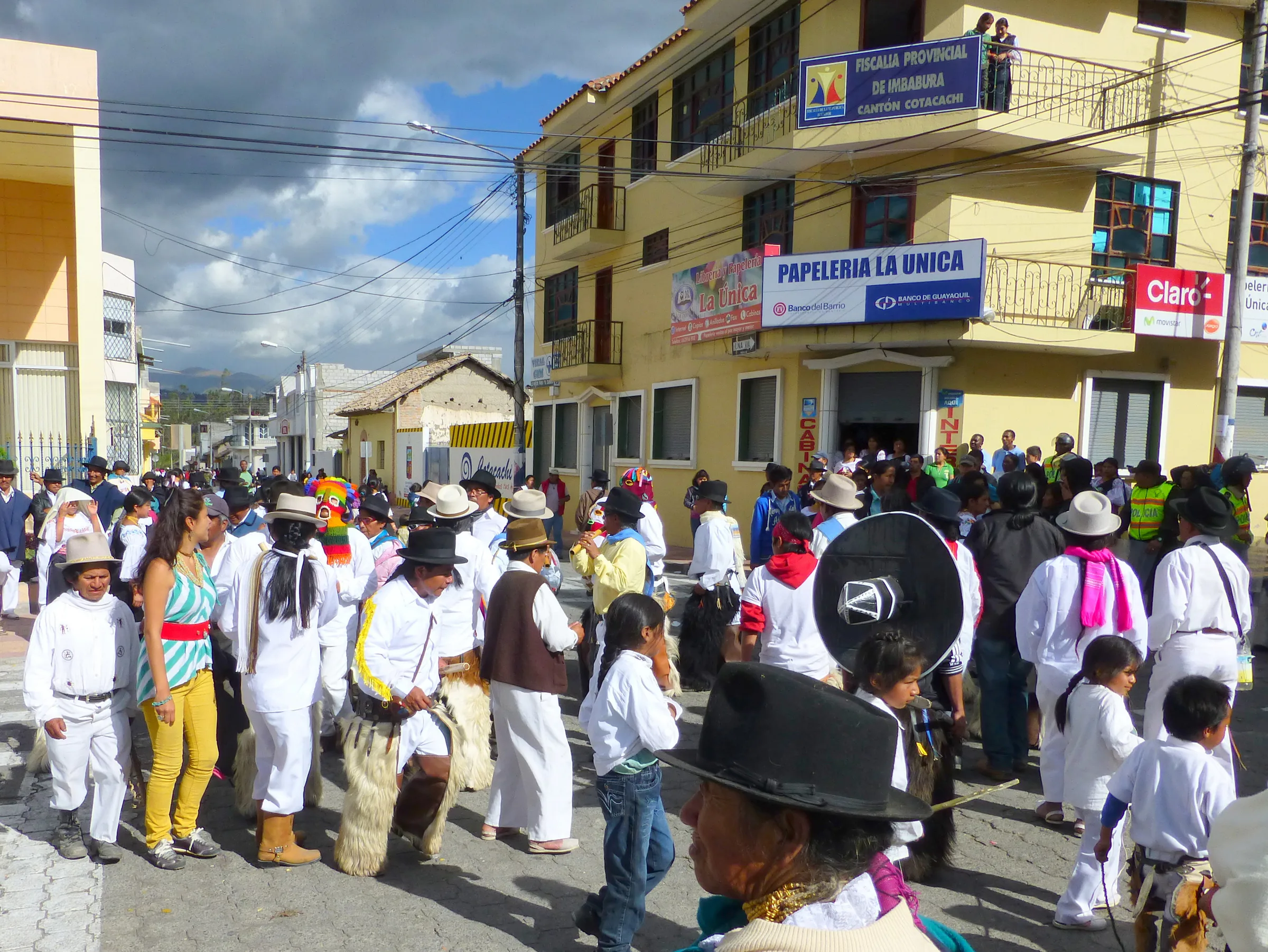 The procession walked in circles for a time.  Per wikitravel.org website, "Cotacachi Village is a small town of 20.000 inhabitants some 20km north of Otavalo. The town is famous for its leather goods."