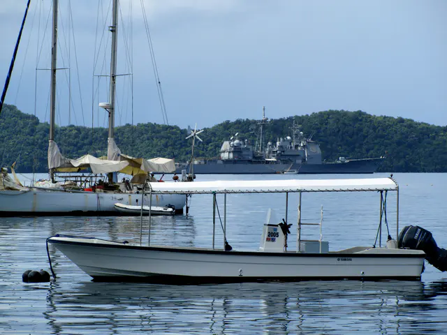 Looking toward the USS Cowpens, a ship that moored in the harbor on Jan. 22 for some R & R for its sailors.  In the foreground is a diveboat that can be used to transport snorkelers and divers to the Rock Islands.