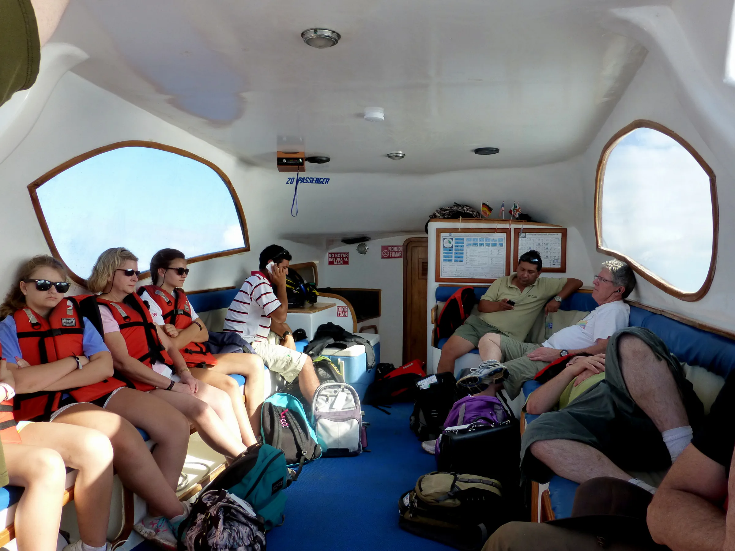 Passengers on the 2 hour plus Red Mangrove ferry boat ride from Santa Cruz to Floreana Islands.