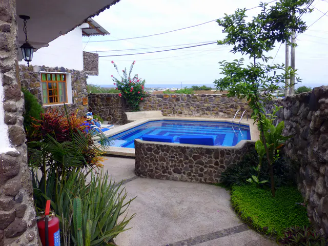 View of bay & swimming pool at the Pimampiro Hosteria, Puerto Baquerizo Moreno.  July 6 - 8, 2012. Our balacony was overhead.