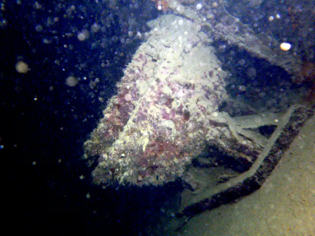 Rice kettle in the ship's galley.   Further in there are stoves. The ship rests on its side.