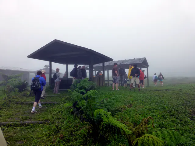 Ranger station and the beginning point of our hike.  Sean stands in the center in a t-shirt and shorts (and no rain gear).  Amazingly, he did quite well traveling so lightly on the hike.