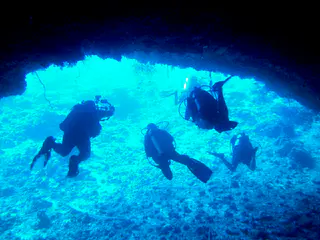 Exiting the Virgin Blue Hole, Palau.  We remain in the upper part of the cavern (at 90' to 100') because the cavern is quite deep.