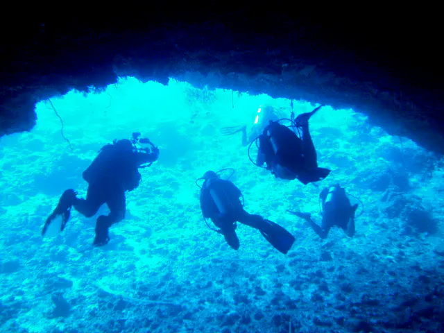 Exiting the Virgin Blue Hole, Palau.  We remain in the upper part of the cavern (at 90' to 100') because the cavern is quite deep.