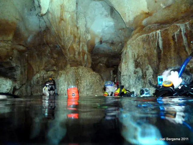 2011-01-14 Chandelier Cave.  Surfacing in the first chamber. Photo courtesy of Bill Ring. c. Bill Ring 2011.