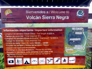 Hike to Volcano Sierra Negra on Isabela Island, betting against the odds that the rain will stop and the clouds will part to allow us a view of the volcano crater and, on the other side, the ocean and its islands.