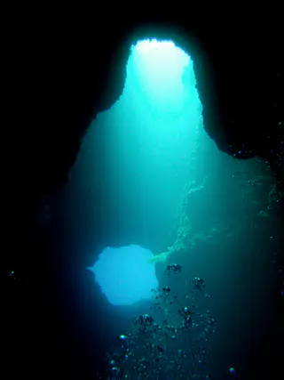 Blue Holes - the lower one is used as an exit leading to a dive along the reef wall and the upper one is used as an entry point.