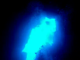 Looking from the cavern up at the entrance to the Virgin Blue Hole, Palau, at about 90'.