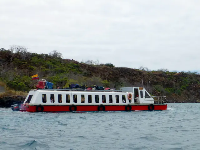 Ferry from Baltra to Santa Cruz. Luggage goes on top, passengers below.  The ferry is slow!  Powered by only two small outboard motors.