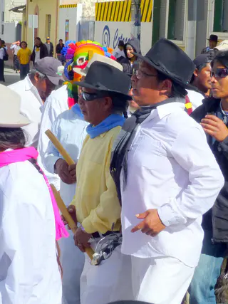 Procession included men with flutes (or perhaps they were sticks) in their hands.  Per wikitravel.org website, "Cotacachi Village is a small town of 20.000 inhabitants some 20km north of Otavalo. The town is famous for its leather goods."
