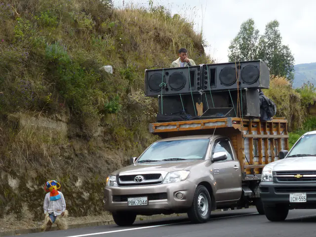Encountering a fiesta / procession on the road to Otavalo.