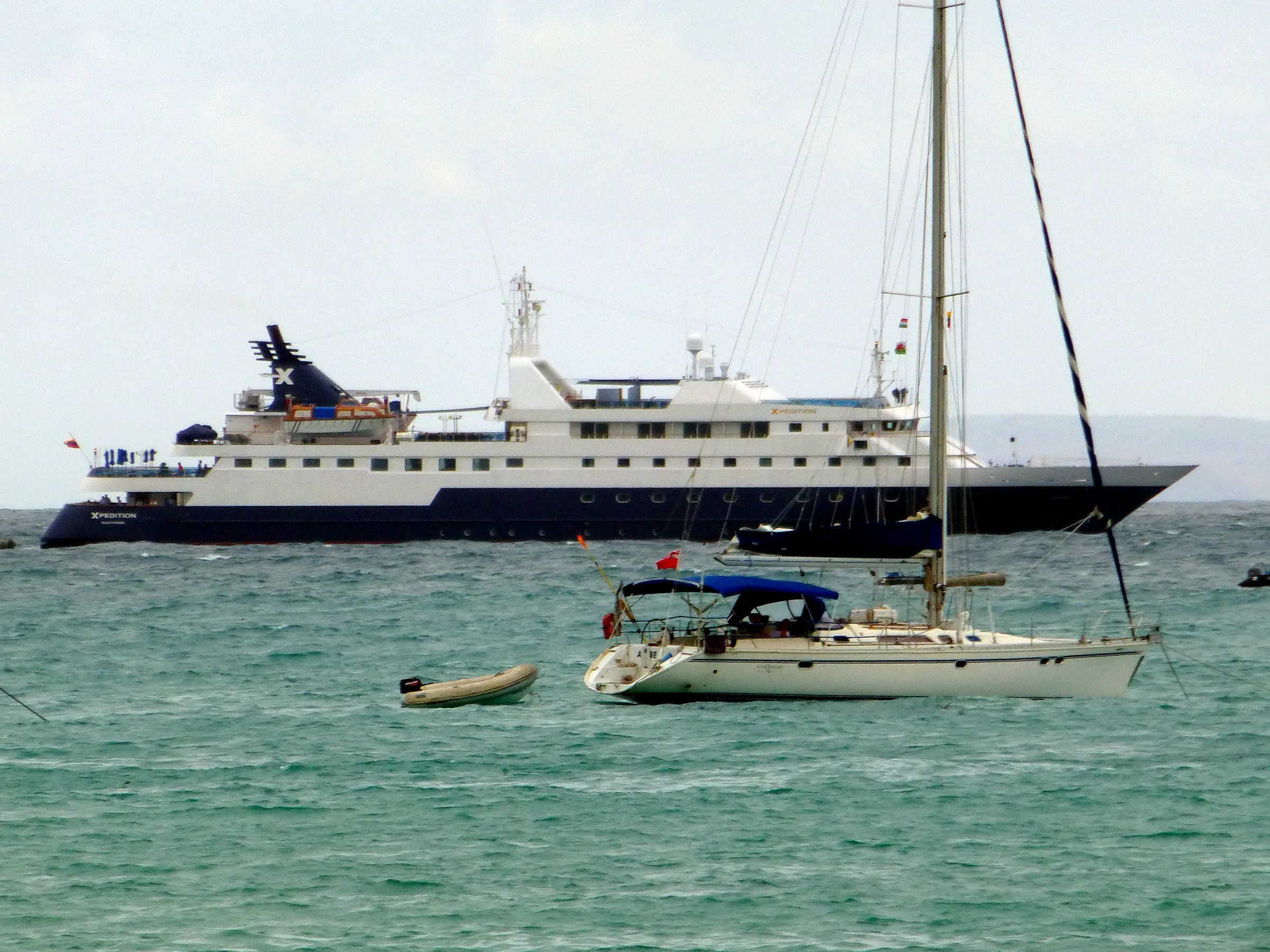 National Geographic's Xpedition cruise ship (1 of 2) at anchor in Puerto Ayora's harbor.