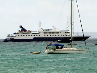 National Geographic's Xpedition cruise ship (1 of 2) at anchor in Puerto Ayora's harbor.