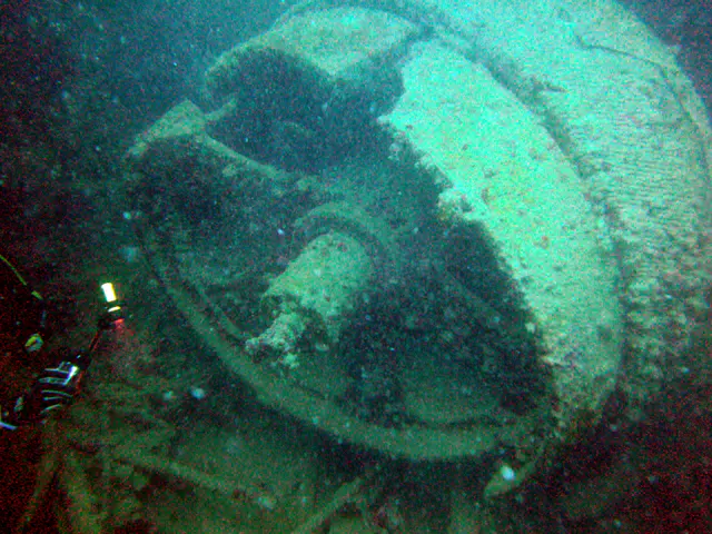 A very large propeller shaft of the LST.