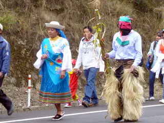 Encountering a fiesta / procession on the road to Otavalo.