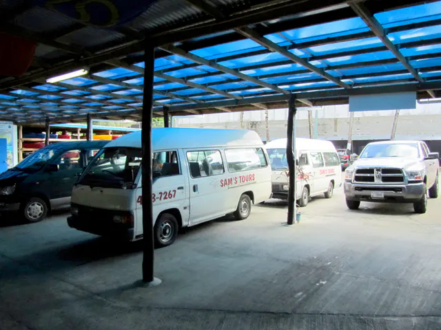 Sam's Tours minivans parked at the arrival area at Sam's Tours.
