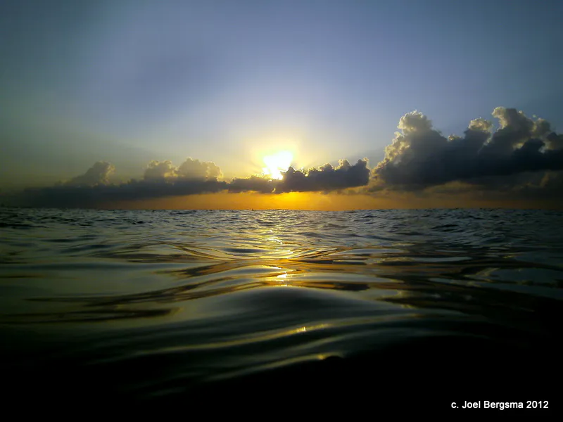 Twilight sunset, taken from the water immediately before descending to begin our twilight - night dive.