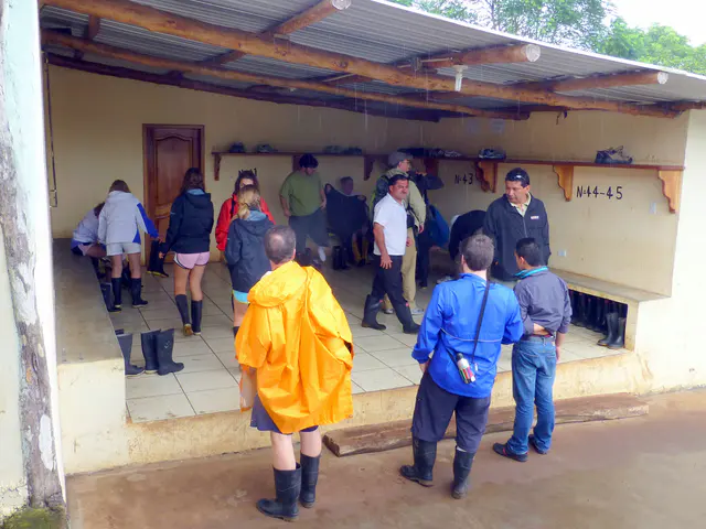 Putting on our boots before venturing into the mud paths of the private Tortoise reserve farm.