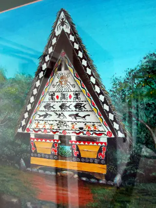 Palauan art of a bai (traditional men's gathering house) displayed at the Judiciary Building.