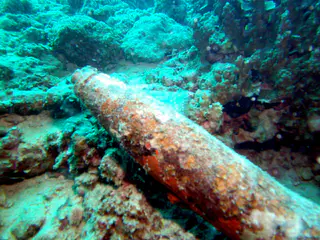 The tip of the bomb is lit by my flash. The bomb lies near the Japanese LST wreckage.