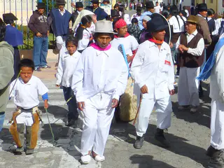 Procession. Per wikitravel.org website, "Cotacachi Village is a small town of 20.000 inhabitants some 20km north of Otavalo. The town is famous for its leather goods."